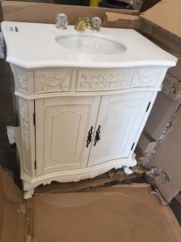 lot 89 image: Winslow 33 in W Bath Vanity in antique white has been previously installed in mint condition