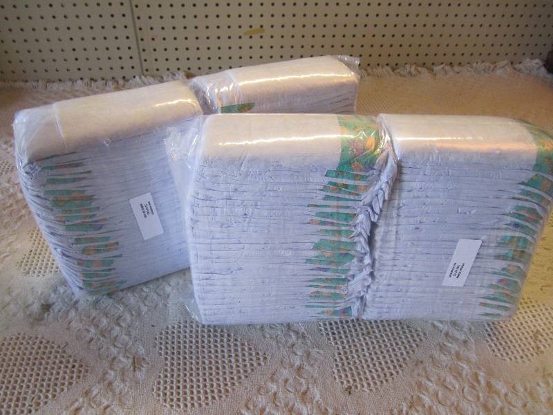 lot 81 image: Lot of 100 Size Medium Diapers 12-2...
