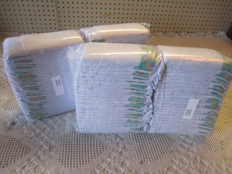 lot 82 image: Lot of 100 Size Medium Diapers 12-2...