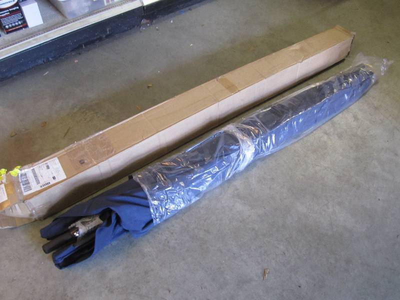 lot 174 image: 10 ft x 6 ft Alum Umbrella Navy Sol...