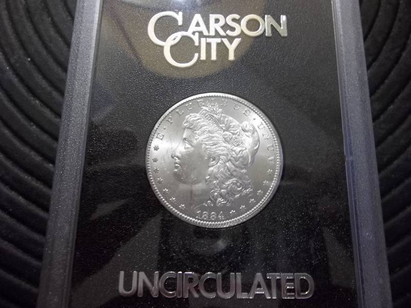 lot 2 image: 1884 CC Morgan Silver Dollar