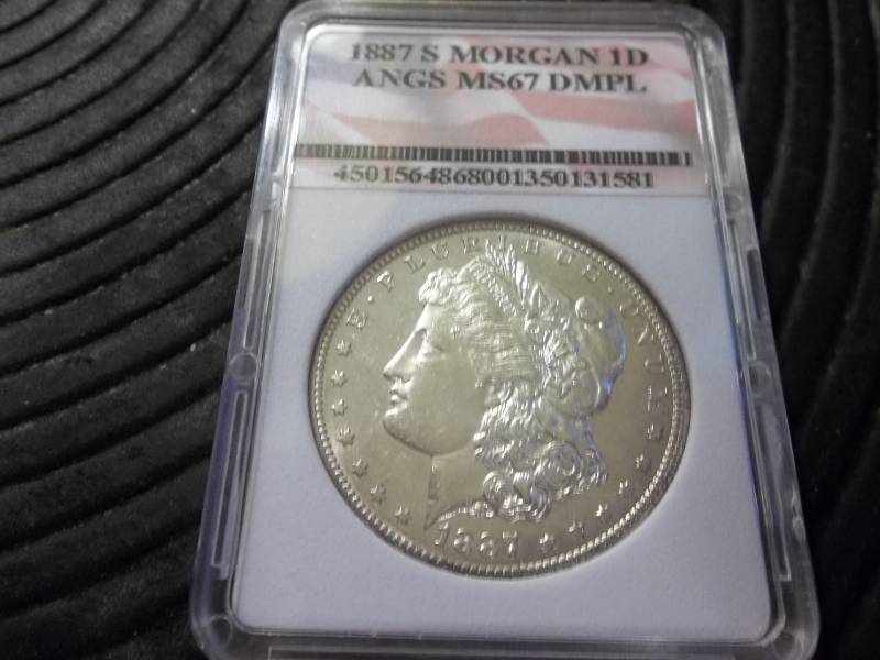 lot 15 image: 1887 S Morgan Silver Dollar