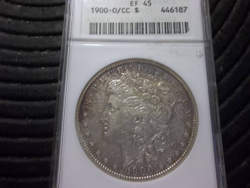 lot 24 image: 1900 OCC Morgan Silver Dollar