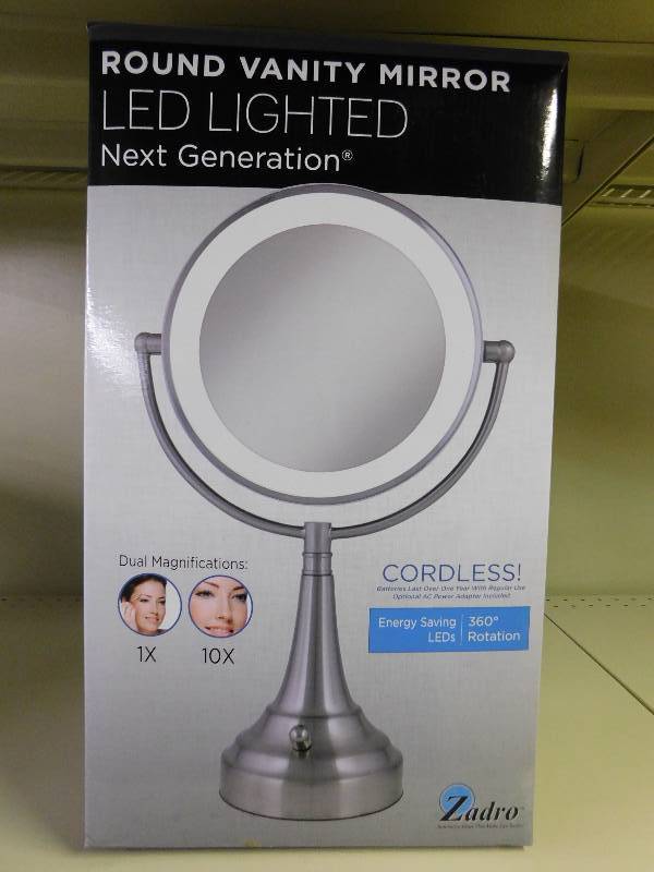 lot 92 image: Next Generation CORDLESS Dual LED LIGHTED VANITY MIRROR, MSRP $144.99