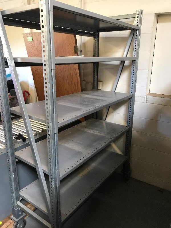 lot 109 image: ADJUSTABLE METAL RACK ON WHEELS