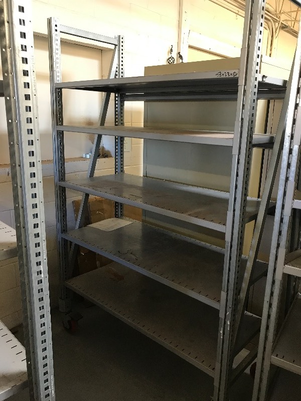 lot 110 image: ADJUSTABLE METAL RACK ON WHEELS