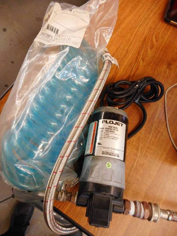 lot 168 image: FLOJET PUMP AND EXTRA HOSE