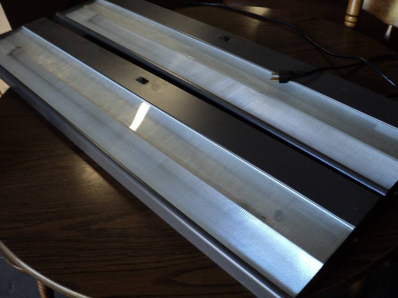 lot 100 image: 2 45x9in lights, for use under coun...
