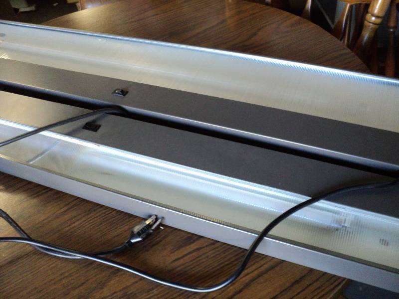 lot 101 image: 2 45x9in lights, for use under coun...