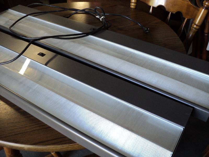 lot 102 image: 2 45x9in lights, for use under coun...