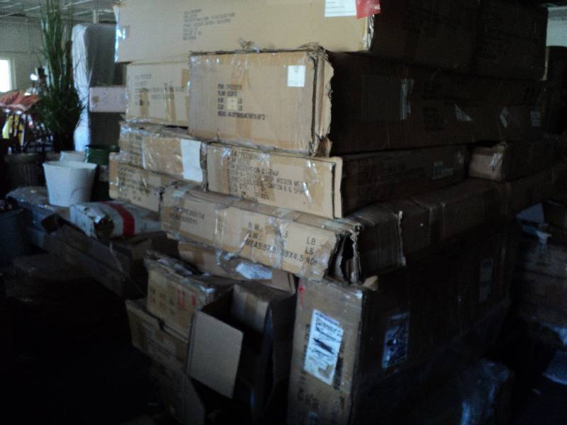 lot 104 image: pallet of overstock furniture stack...