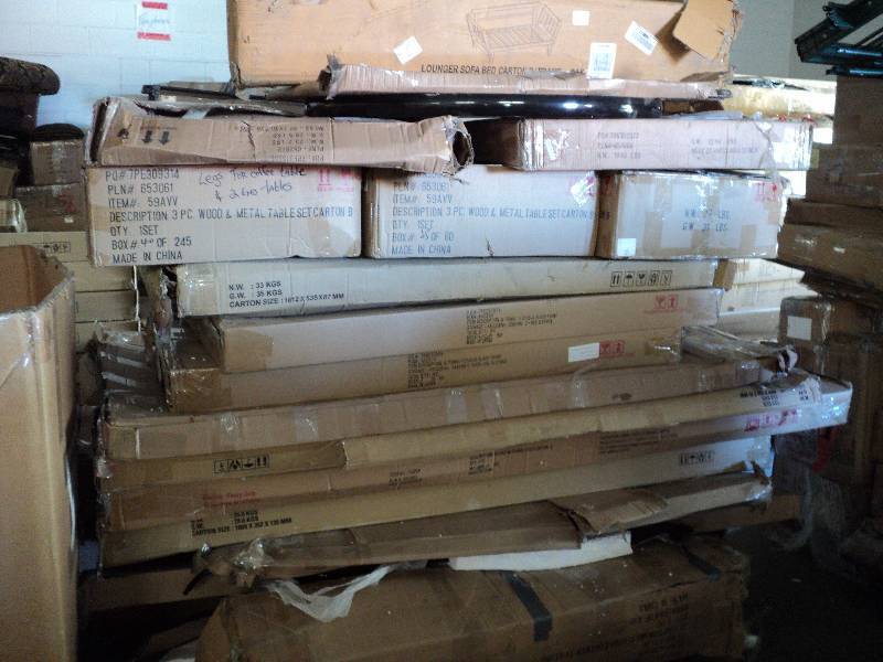 lot 105 image: pallet of overstock furniture stack...