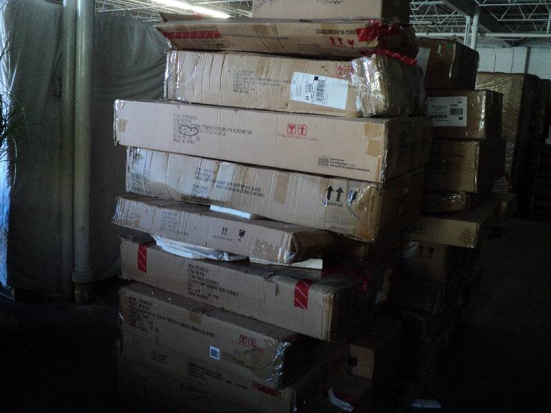 lot 107 image: pallet of overstock furniture stack...