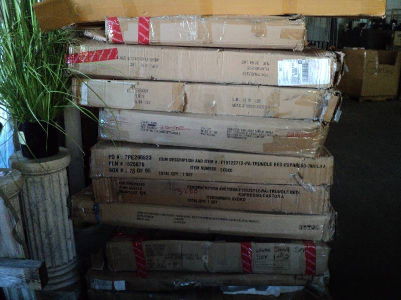 lot 108 image: pallet of overstock furniture stack...