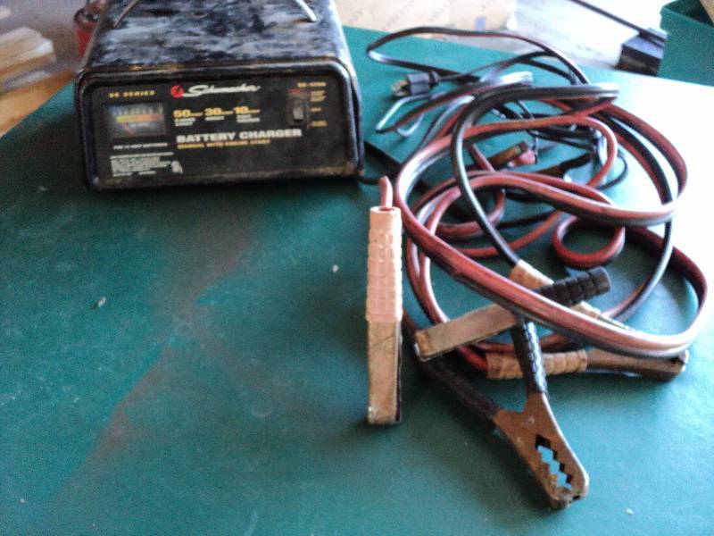 lot 135 image: battery charger and jumper cables...