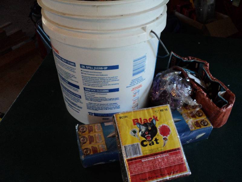 lot 170 image: 5gal pail with lid full of firecrac...