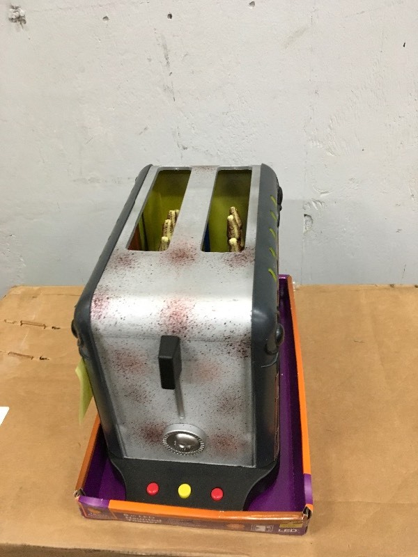 lot 19 image: Haunted Toaster - battery needs to be replaced