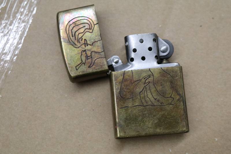 lot 83 image: Vintage Viet Nam Carved Zippo Lighter