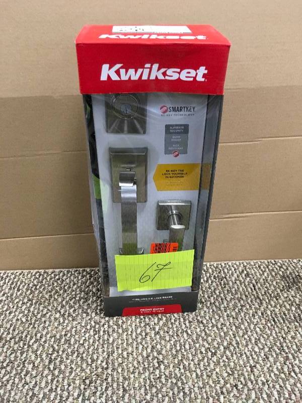 lot 67 image: Kwikset Tavaris Single Cylinder Satin Nickel Handleset with Vedani Lever featuring SmartKey. Open Package not used