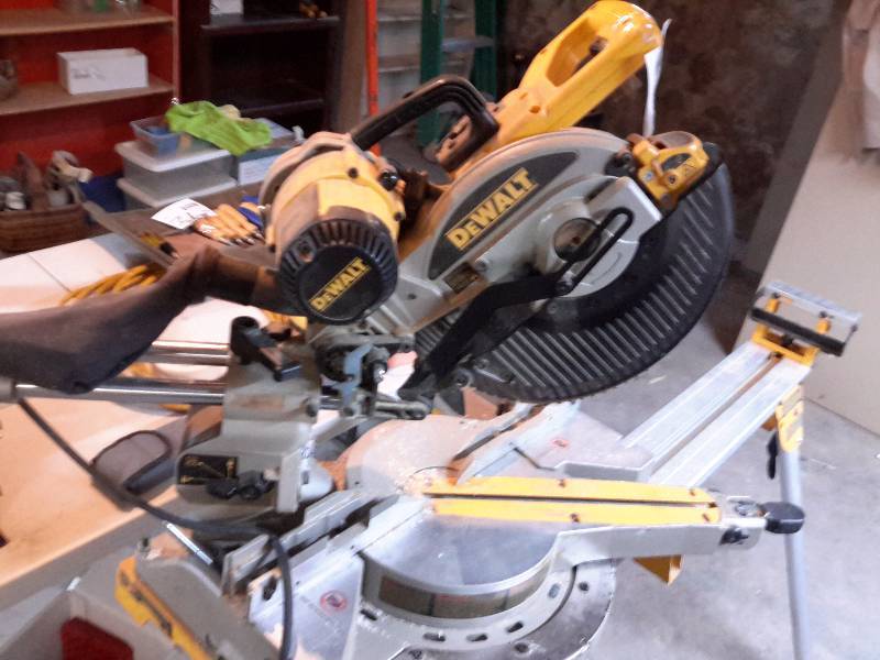 lot 1 image: Dewalt, 10 in Double Bevel Sliding Compound Miter Saw and stand