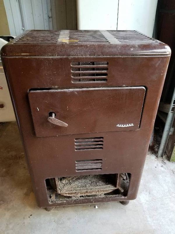 lot 24 image: Kenmore Heater Stove, 44x27x16