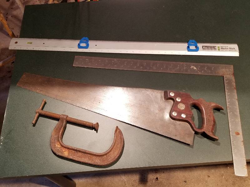 lot 110 image: Lot - Saw, C-Clamp, Level