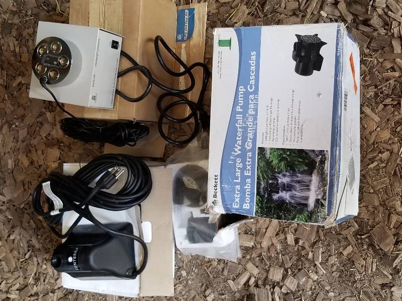 lot 215 image: Lot - Pond Xlarge Water Pump, Transformer, Sunterra, Etc