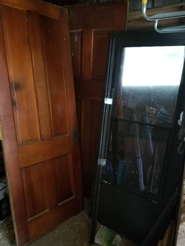 lot 216 image: Lot - Doors - Vintage Wood Paneled Door & Storm Door