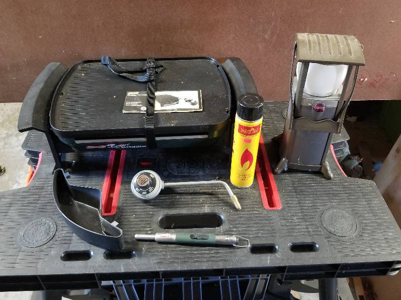 lot 348 image: Lot - Camping Items - Coleman Grillin Griddle, Coleman Lantern