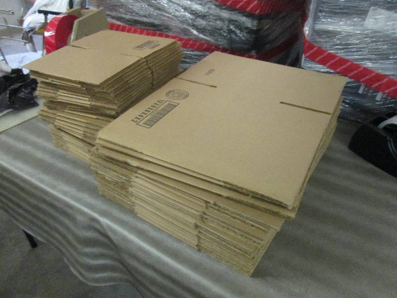 Stack of 2 Sizes Cardboard Boxes...