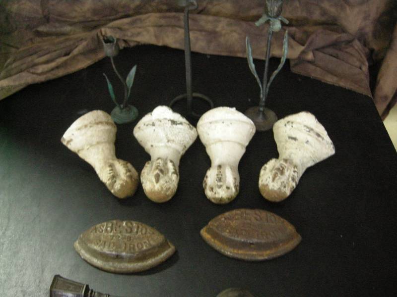 lot 5 image: Antique Cast Iron Feet and Irons - Holders
