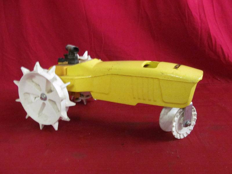 lot 27 image: Nelson cast iron tractor sprinkler