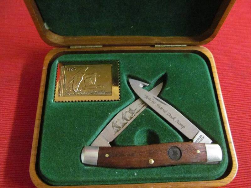 lot 59 image: commeriative duck knife, stamp