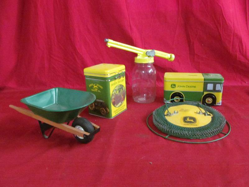 lot 80 image: John Deere tin, bank , bird feeder, wheelbarrow