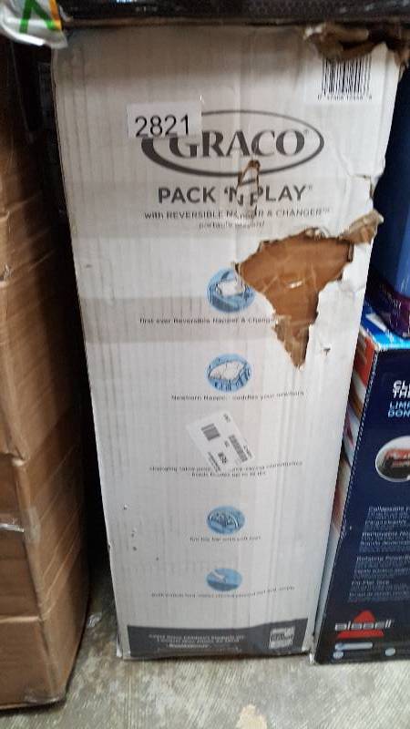 lot 2821 image: Graco Pack n Play with Bassinet and Napper  Changer - Pink