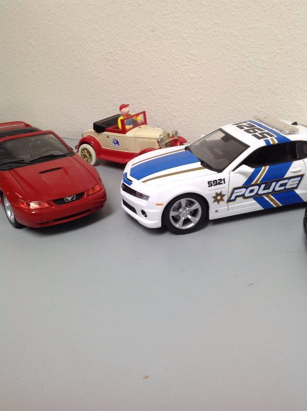 Black Corvette, Red Convertible Mustang, White Police Car and a 1st in a Series 1992- toy cars