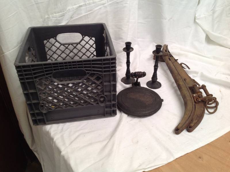 lot 17 image: Cast iron Waffle Maker, Candle sticks and a horse Yolk, with plastic crate
