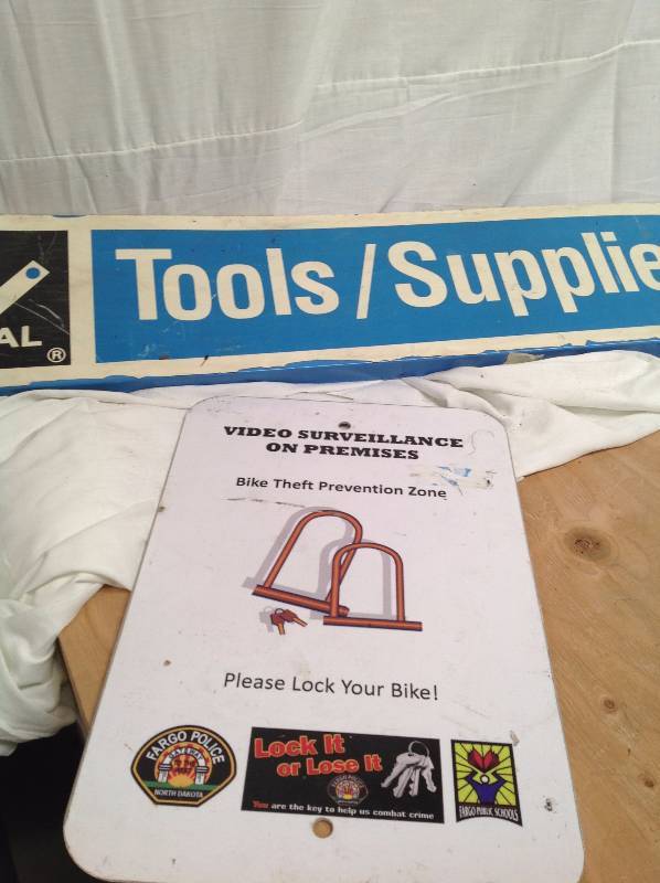 lot 41 image: Two Metal Signs, ToolsSupplies and Bike Theft Prevention
