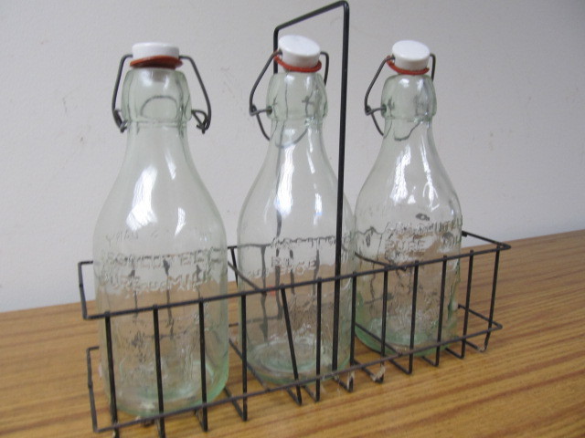 lot 150 image: 3 Vintage THATCHERS DAIRY Embossed Milk Bottles wCarrier