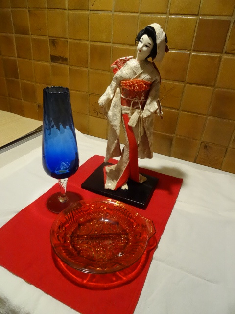 Asian porcelain doll. Colored candy...