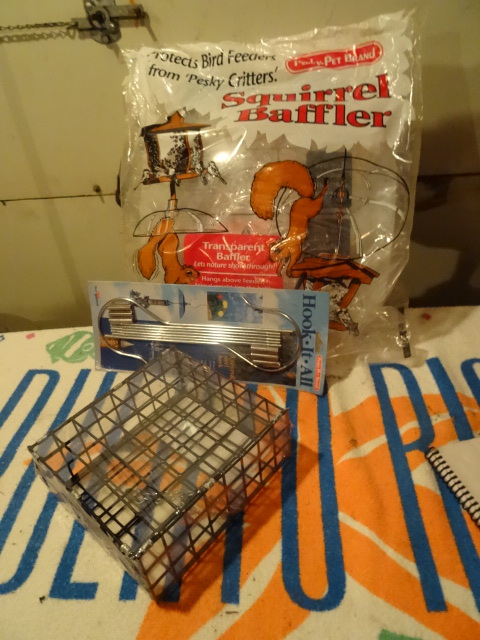 2 squirrel baffles. Hook it all. Ha...