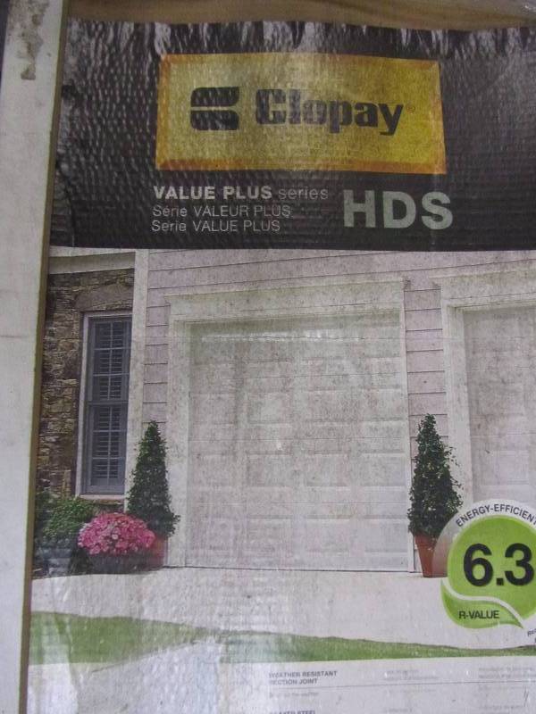 lot 50 image: Clopay Value Plus Series 8 ft. x 7 ft. 6.3 R-Value Insulated White Garage Door