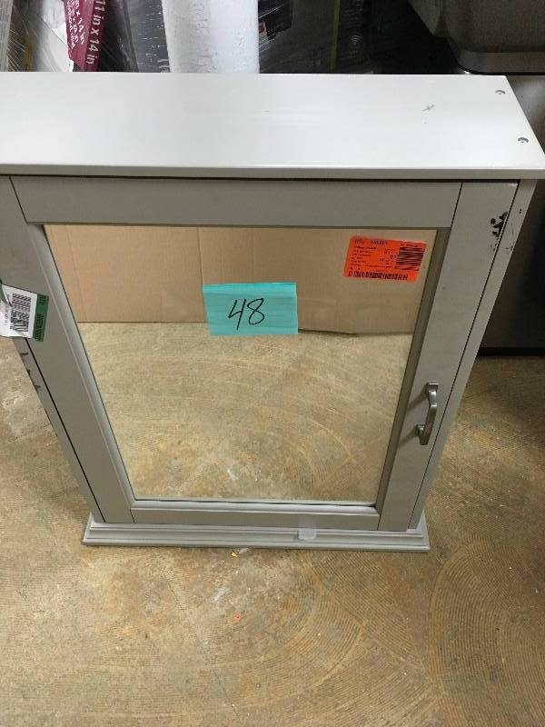 lot 48 image: Foremost Ashburn 23 in. W x 28 in. H x 8 in. D Framed Wood Surface-Mount Bathroom Medicine Cabinset in Grey. New Open Box