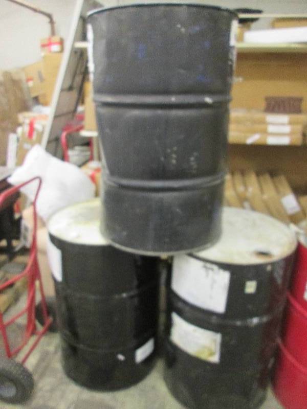 3 metal 55 gallon drums . tops are ...