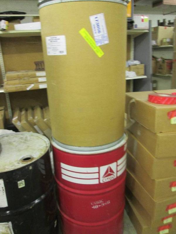 1 metal 55 gallon drum and 1 cardbo...