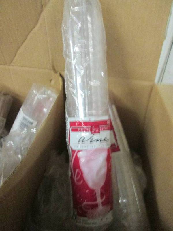 box of plastic wine glasses with ba...