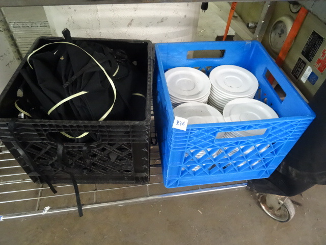 lot 236 image: Misc black aprons. Crate of saucers.