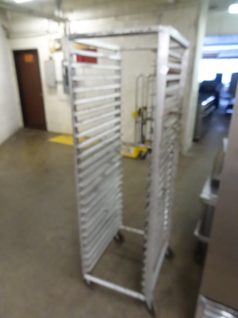 lot 279 image: Full size sheet pan rack on wheels.