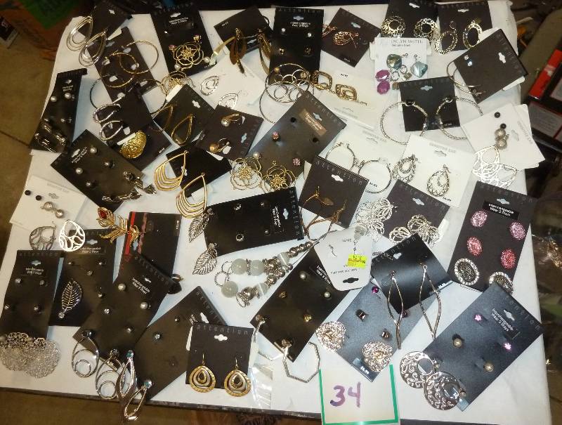 Lot of earrings, most are priced $7...