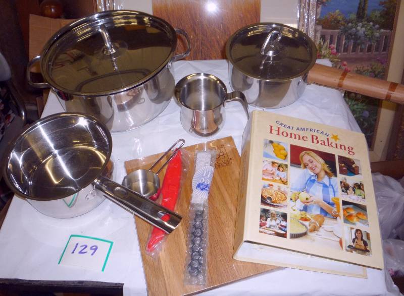 set of new pots and pans, cutting b...